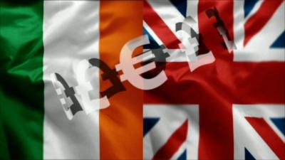 Graphic of Irish and British flags overlaid with sterling and euro signs