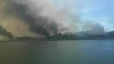 Smoke rises over the island that came under attack