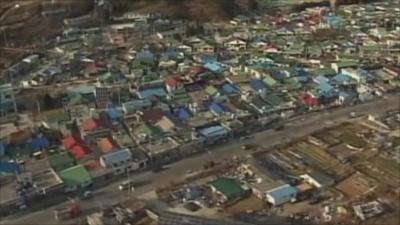 Aerial view of damaged buildings