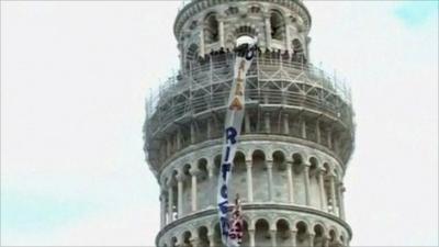 Protesters occupy the Leaning Tower of Pisa