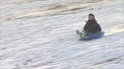 Child on toboggan