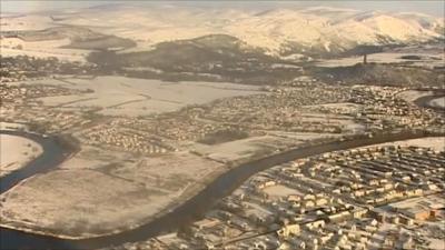 Aerial views of snowbound Scotland