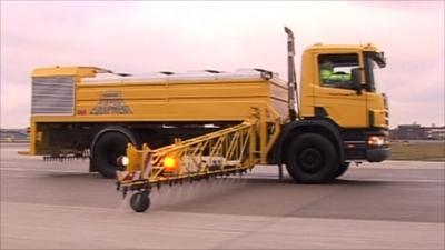 Clearing snow off the runway at Heathrow