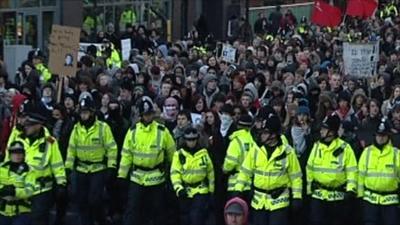 Students march through the centre of Manchester