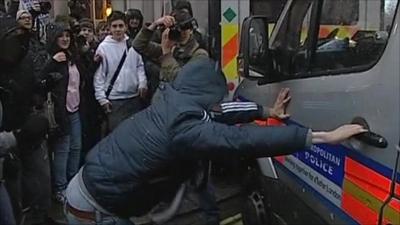 Protester tries to break into police van