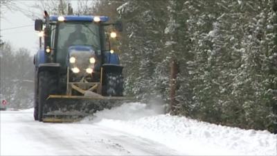 Tractor clearing snow