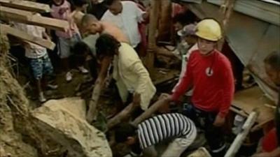 Searching through rubble after mudslide