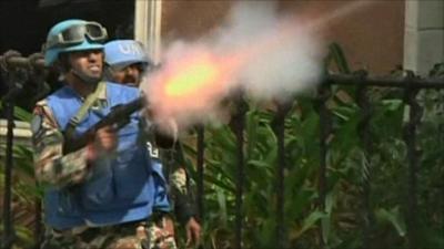 UN soldier fires tear gas