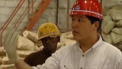 Chinese foreman working on African construction site