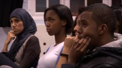 Young Londoners listen to a youth worker from Burundi