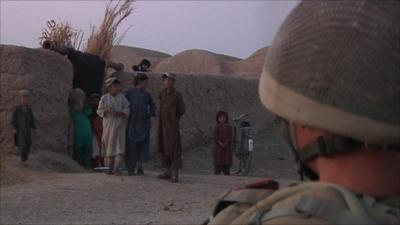 Soldier with Afghan people