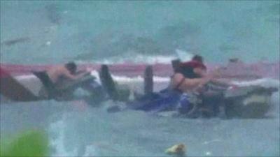 Survivor clings to wreckage