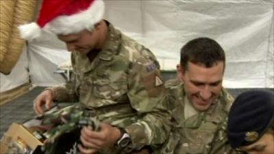 Soldier opening presents