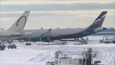 Aeroplanes snowed in at New York's JFK airport