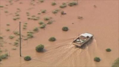 Truck driving through floods