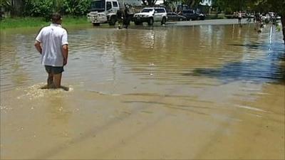 Man wading in floodwater