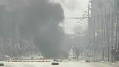 Smoke in street in Ivory Coast's main city, Abidjan