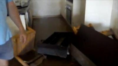 Alex Finlayson filmed inside his flooded home