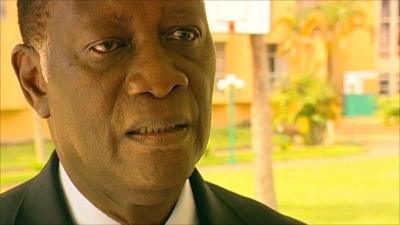 Alassane Ouattara spoke to the BBC from the hotel where is kept under guard