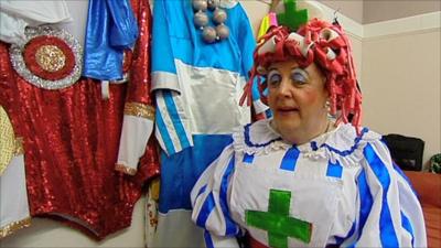 Nurse Poltis dons her new green cross