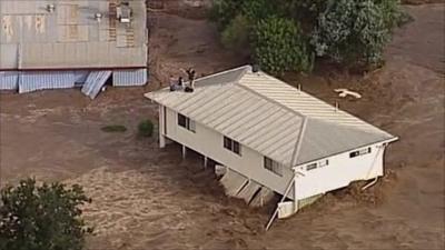 House washed away by flood waters