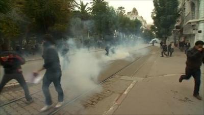 Protesters amid tear gas