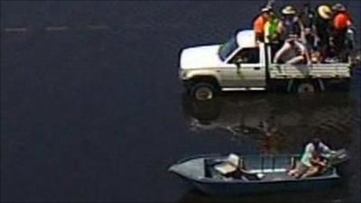 Small boat saves people stranded on truck