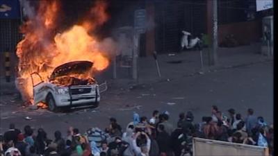 Protesters set a van on fire