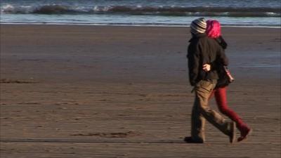 Couple walking on a beach