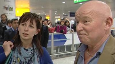 Two passengers who have just arrived back in the UK from Cairo