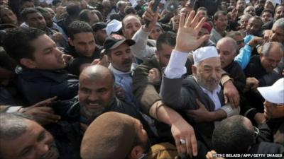 Rachid Ghannouchi in the crowd at the Tunis-Carthage airport