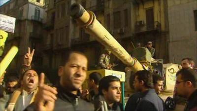 Tank with protesters