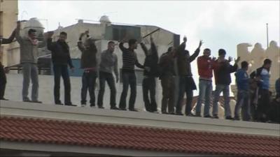 Protesters on roof in Alexandria