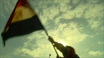 Protester waving Egyptian flag