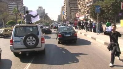 Protesters in cars