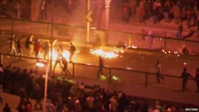 Fire and protesters in Tahrir Square