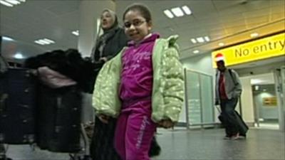 People arrive back at Gatwick airport from Cairo