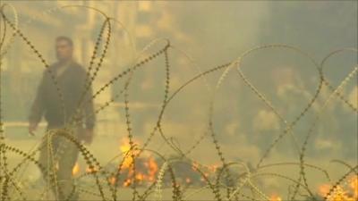 Protester walks away from fire