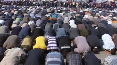 Protesters praying