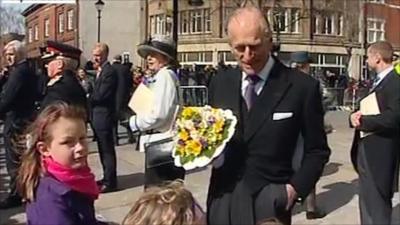 Prince Philip greeting children