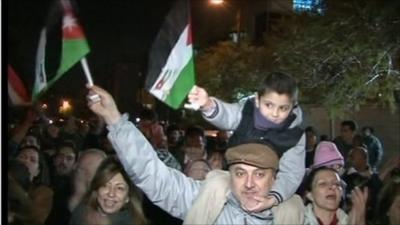 Father and son celebrating in the street