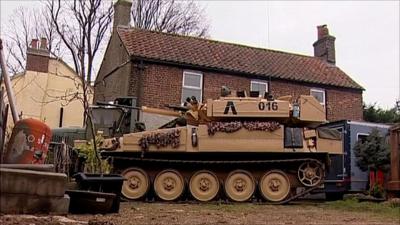 The man with a tank in his garden