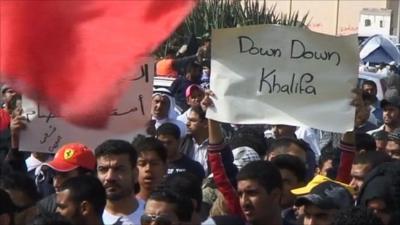 Protester with anti-government slogan