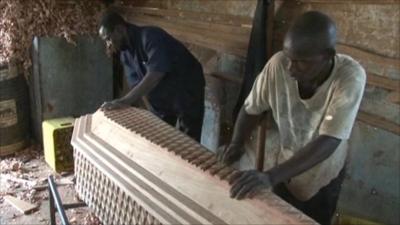 Men making a coffin in Sierra Leone