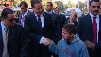 David Cameron meets boy in Cairo