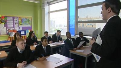 Students and a teacher in a classroom