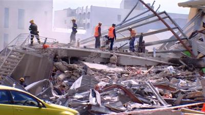 Rescue workers in the rubble