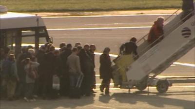 Passengers board plane for Britain