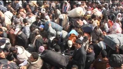 Thousands wait to cross the border