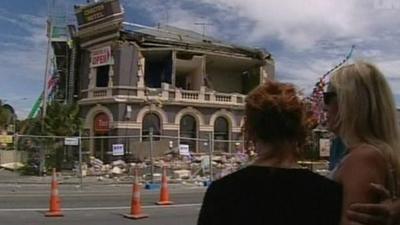 Residents of Christchurch observe a two minute silence